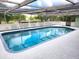 Private swimming pool with a fenced-in surround for safety and privacy at 273 Gulfport Ln, Spring Hill, FL 34608