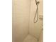 Close-up of shower with white tiles and handheld shower head at 273 Gulfport Ln, Spring Hill, FL 34608