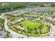 Aerial view of the neighborhood showcasing the pool, park, sidewalks and community amenities at 2815 Dudley Ave, Odessa, FL 33556