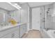 Elegant bathroom with double vanity, a glass shower, and a luxurious soaking tub at 2815 Dudley Ave, Odessa, FL 33556