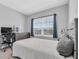 Bedroom with a desk, modern computer, and a large window for natural light at 2815 Dudley Ave, Odessa, FL 33556