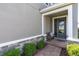 Charming front porch with stone accents, bench, and well-maintained landscaping at 2815 Dudley Ave, Odessa, FL 33556
