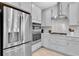 Modern kitchen features stainless steel appliances, white cabinetry, and stylish countertops at 2815 Dudley Ave, Odessa, FL 33556