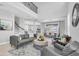 Inviting living room with soaring ceilings, neutral tones, and seamless flow to dining area and second story at 2815 Dudley Ave, Odessa, FL 33556