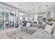 Open concept living space featuring large sectional and a view of outdoor patio area at 2815 Dudley Ave, Odessa, FL 33556
