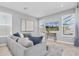 Bright living room with a comfortable sofa, stylish decor, and plenty of natural light at 2815 Dudley Ave, Odessa, FL 33556