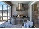 Outdoor kitchen complete with a grill, sink, and mini-fridge, perfect for entertaining at 2815 Dudley Ave, Odessa, FL 33556