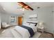 Comfortable bedroom featuring neutral decor, a ceiling fan, and ample natural light at 3029 Harrow Rd, Spring Hill, FL 34606