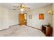 Large bedroom with neutral walls and carpet, ceiling fan, and access to the hallway at 3029 Harrow Rd, Spring Hill, FL 34606