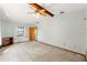 Large bedroom with beamed ceiling and neutral carpet has easy access to an ensuite bathroom at 3029 Harrow Rd, Spring Hill, FL 34606