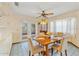 Cozy dining area with natural light, a table for four, and French doors to the exterior at 3029 Harrow Rd, Spring Hill, FL 34606