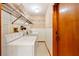 An interior laundry room with washer, dryer and storage at 3029 Harrow Rd, Spring Hill, FL 34606