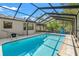 Enjoy this screened-in pool and patio, perfect for relaxing or entertaining in your backyard at 3029 Harrow Rd, Spring Hill, FL 34606