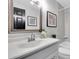 Fresh bathroom with a vanity, framed mirror, and tub with shower at 3047 Bolt Dr, Palm Harbor, FL 34685