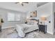 A cozy bedroom features a plush bed, stylish decor, and plenty of natural light from the window at 3047 Bolt Dr, Palm Harbor, FL 34685