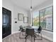 Cozy breakfast nook with stylish lighting and a view of the backyard at 3047 Bolt Dr, Palm Harbor, FL 34685