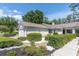 Well-maintained home with meticulous landscaping, enhancing curb appeal at 3047 Bolt Dr, Palm Harbor, FL 34685