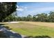 Scenic view of the lush green golf course from the property at 3047 Bolt Dr, Palm Harbor, FL 34685