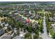 Neighborhood aerial showcasing well-maintained homes with trees and landscaping at 3057 Riders Pass, Odessa, FL 33556