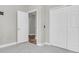 Neutral bedroom with carpeting, large closet, and entry door to the main bedroom area for seamless living at 3057 Riders Pass, Odessa, FL 33556