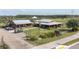 Sprawling commercial property featuring dual buildings, gazebo, and picturesque landscaping at 3057 Riders Pass, Odessa, FL 33556