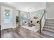 Welcoming foyer with elegant decor, staircase, and stylish chandelier at 3057 Riders Pass, Odessa, FL 33556