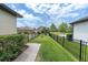 Neatly maintained front yard with lush grass, brick walkway, and decorative shrubbery, enhancing curb appeal at 3057 Riders Pass, Odessa, FL 33556