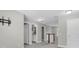 Upstairs hallway view with carpet and neutral walls and access to bathroom at 3057 Riders Pass, Odessa, FL 33556
