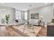 Cozy living room featuring modern decor, hardwood floors, and stylish furniture at 3057 Riders Pass, Odessa, FL 33556