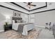 Stylish bedroom with tray ceiling, ceiling fan, plush carpeting and neutral decor at 3057 Riders Pass, Odessa, FL 33556