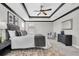 Stylish bedroom with tray ceiling, ceiling fan, plush carpeting and neutral decor at 3057 Riders Pass, Odessa, FL 33556