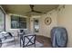 Covered patio featuring outdoor seating, string lights, and a ceiling fan for relaxing at 3057 Riders Pass, Odessa, FL 33556
