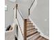 Close up of staircase with decorative stair risers and wooden handrail at 3057 Riders Pass, Odessa, FL 33556