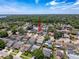 The aerial view showcases a single-Gathering home in a lushly landscaped community, providing a sense of privacy and tranquility at 3074 Cara Ct, Palm Harbor, FL 34684