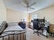 Bedroom featuring neutral colors, a single bed, and a desk for work or study at 3074 Cara Ct, Palm Harbor, FL 34684