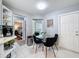 Cozy breakfast nook with a glass table, seating for four, and natural light from a nearby window at 3074 Cara Ct, Palm Harbor, FL 34684