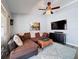 The well-lit living room features a large sectional, entertainment center and stylish decor at 3074 Cara Ct, Palm Harbor, FL 34684