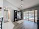 Spacious living room with sliding glass doors overlooking the pool area at 3074 Cara Ct, Palm Harbor, FL 34684