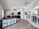 Open concept living room showcasing wood floors, natural light, and seamless flow into the kitchen at 3074 Cara Ct, Palm Harbor, FL 34684