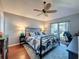 Cozy main bedroom with decorative fan, hardwood floors, and natural light at 3074 Cara Ct, Palm Harbor, FL 34684