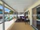 View of screened patio with comfortable seating at 3074 Cara Ct, Palm Harbor, FL 34684