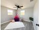 Versatile bedroom with modern flooring, ample natural light, and a playful teepee for added charm at 3545 Oxford Dr, Holiday, FL 34691