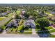 Located at 4044 Chesterfield Dr, Spring Hill, this house features a well-manicured lawn and mature landscaping at 4044 Chesterfield Dr, Spring Hill, FL 34609