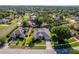 This attractive single-story home boasts a well-kept yard, mature trees, and an inviting walkway to the front door at 4044 Chesterfield Dr, Spring Hill, FL 34609