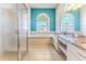 Bright bathroom featuring a large soaking tub, glass shower, and granite countertops with dual sinks at 4044 Chesterfield Dr, Spring Hill, FL 34609