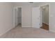 Bedroom with plush carpet, neutral wall colors, and doors to a closet and other rooms at 4044 Chesterfield Dr, Spring Hill, FL 34609