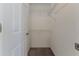 Walk-in closet with white walls, carpeted floor, and metal shelving for ample storage at 4044 Chesterfield Dr, Spring Hill, FL 34609