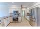 Updated kitchen featuring stainless steel appliances, granite countertops, white cabinets, and tile flooring at 4044 Chesterfield Dr, Spring Hill, FL 34609