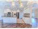 Open kitchen with stainless steel appliances, granite countertops, tile backsplash, and white cabinetry at 4044 Chesterfield Dr, Spring Hill, FL 34609