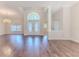 Spacious living room featuring hardwood floors and lots of natural light at 4044 Chesterfield Dr, Spring Hill, FL 34609
